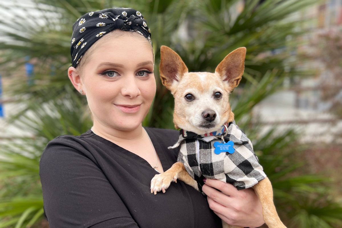 Kaylee holding dog